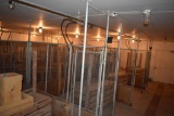 Nesting boxes, feeders, metal fencing panels entire room on south end of building 7