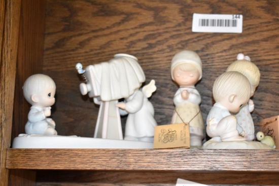 4 Precious Moments Figurines
