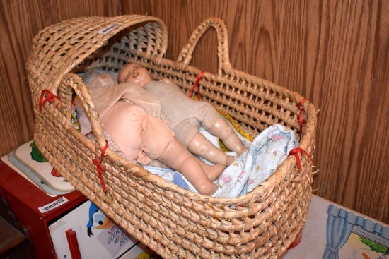 Wicker bassinet and dolls