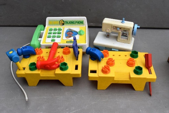 Children's sewing machine, Little Tikes tool sets, and talking phone