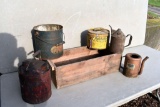 Wooden box, metal gas cans, and other metal cans