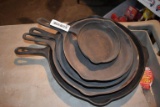 5 Cast iron pans, including Griswold and Wagner