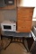 Microwave, file cabinet and a work table