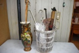 Vase, wicker basket, canes and umbrellas]
