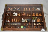 Shadow box with thimbles, knives, figurines and other items