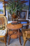 Oval wicker table and vase