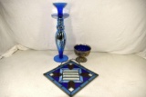 Assortment of blue glass and stain glass picture