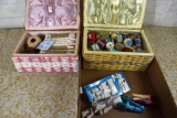 Assortment of sewing items and sewing basket