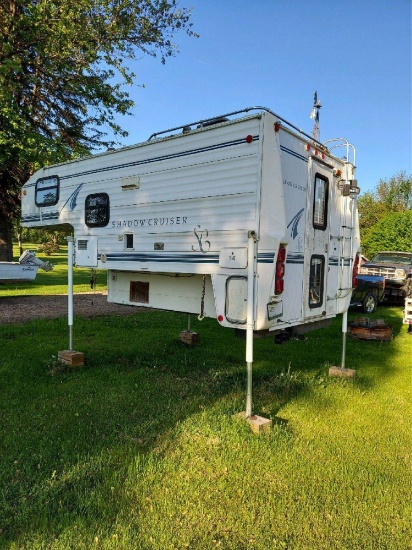 Shadow Cruiser Pickup Box Camper with stands, has water damage