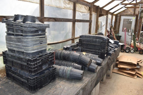 large assortment of plastic planter pots, located in Building 94