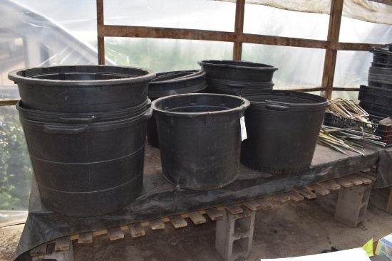 assortment of large plastic planters, located in Building 94