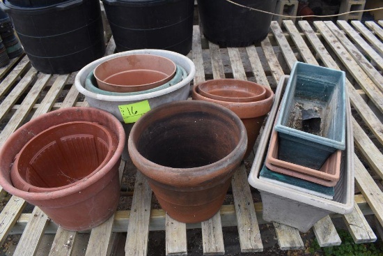 Assorted plastic and terracotta pots , located in GH 9