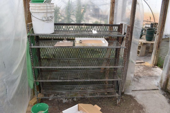 Metal 5 shelf rack with buckets , located in Building 94