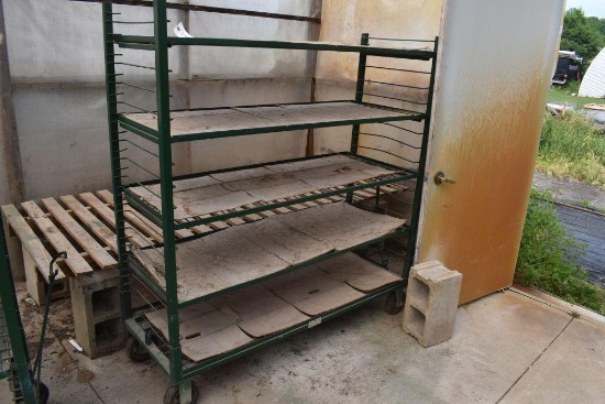 Metal rolling 5 tier shelf unit , located in Building 94