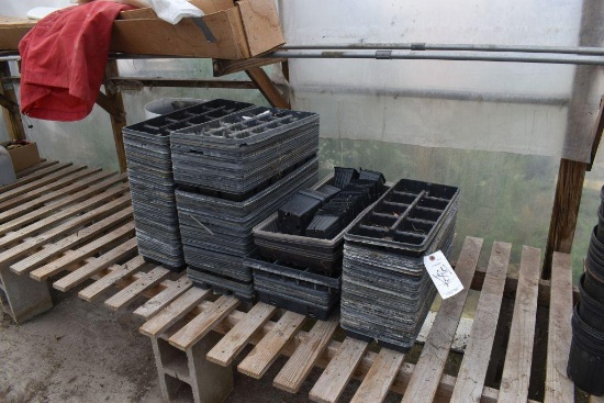 Assortment of planter pots , located in Building 94