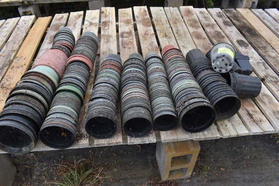 Large assortment of used plastic pots , located in GH 9