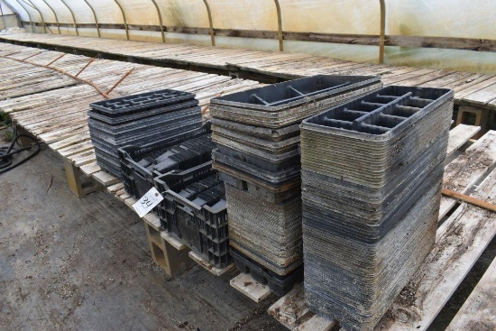 Assortment of plastic trays and pots , located in GH 24