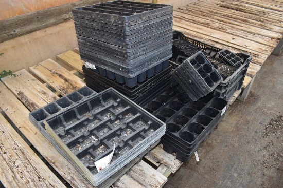 Assortment of plastic pots and trays, located in GH 24