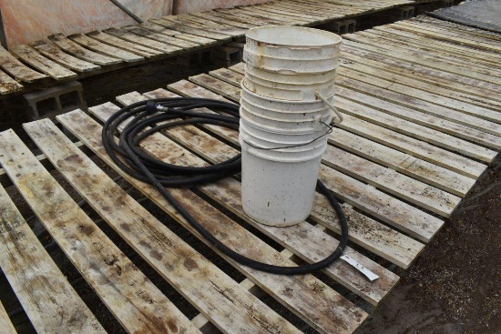Garden hose and 5 gallon pales, located in GH 71