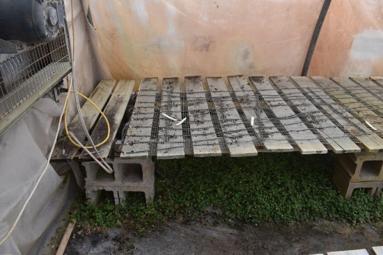 64"x64' and 48"x72' wooden greenhouse garden bench with cinder blocks, located in GH 71