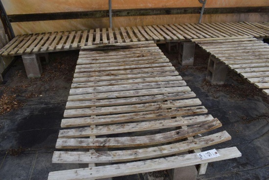 48"x152' wooden greenhouse garden bench with cinder blocks , located in GH 84
