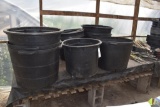 assortment of large plastic planters, located in Building 94