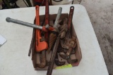 Large assortment of pipe wrenches , located in Building 94