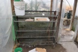 Metal 5 shelf rack with buckets , located in Building 94