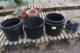 Used plastic tree pots , located in GH 9
