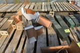Assortment of flower pots and trays , located in GH 197