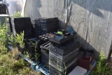 Planter trays with carrying cases on plastic pallets