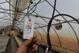180' hanging water hose with irrigation lines, located in GH 71