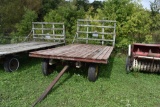 8 ft x 16 ft wooden hay rack with running gear