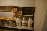 Wall Shelving on right side of room next to piping