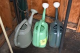 Three watering cans