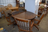 Round Table with one leaf and four chairs on casters