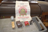 Hulting's seed corn bag, match holder, hooks, tobacco tin