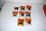 8 assorted Ertl implements on cards