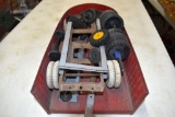 Press Steel parts trailer with assorted toy wheels and parts