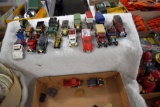 Assortment of beer advertising trucks and cars