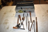 Plastic tool box containing wood chisels, files, rasps