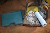 Cloth hamper containing shop rags and Makita battery charger in plastic case