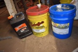 3 partial containers of engine oil