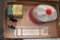 International Emblem, John Deere powdered graphite tin, M.F.E Thermometer, and Funks hat