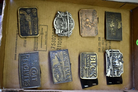 Eight belt buckles: 2 Colt revolvers, Winchester, Oregon Guns, Buck Knives, Pony Express, Knotts