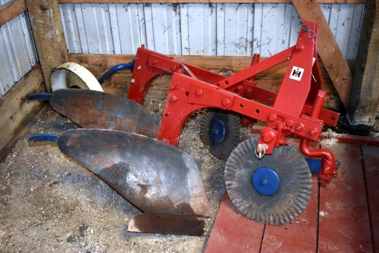 Restored International 2x16 Three Pt. mounted plow, with ripple coulters and steel tail wheel