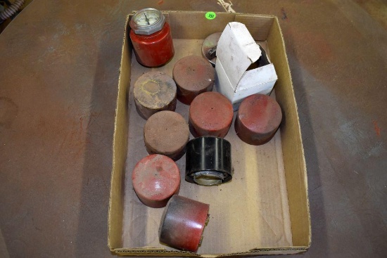 9 Farmall fuel caps and a fuel gage