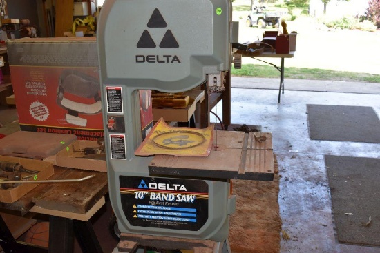 Delta 10" bandsaw with extra blade, 120 volt, 1/2 hp motor on stand