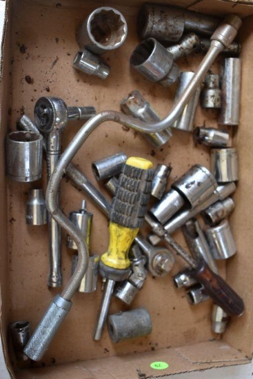 Assortment of 1/2" drive sockets, ratchets, and extensions