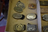 Six belt buckles: Grove OK, German Shepherd, Jakes Seed Corn, Pete, Critters, Stoffer Seed Corn